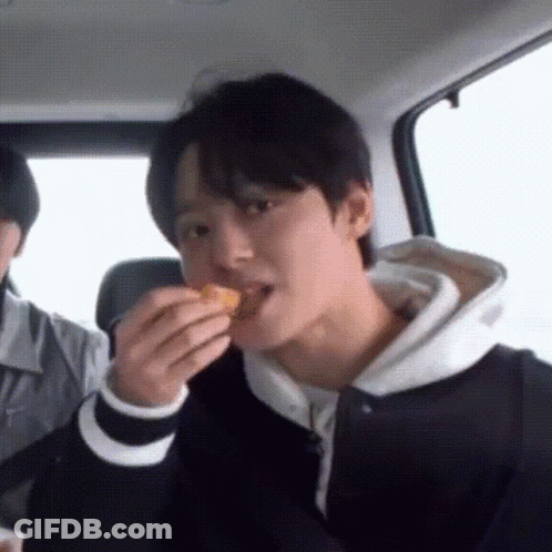 Man Eating In Car While Another Watches GIF