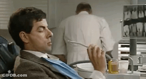 Man Eating In Dental Chair Dentist Examining Teeth GIF