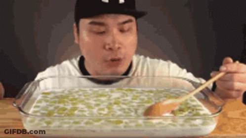 Man Eating Large Amount Of Food With Spoon GIF