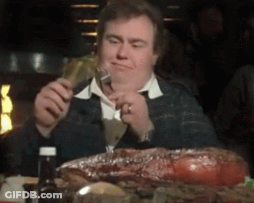 Man Eating Large Meat Piece GIF