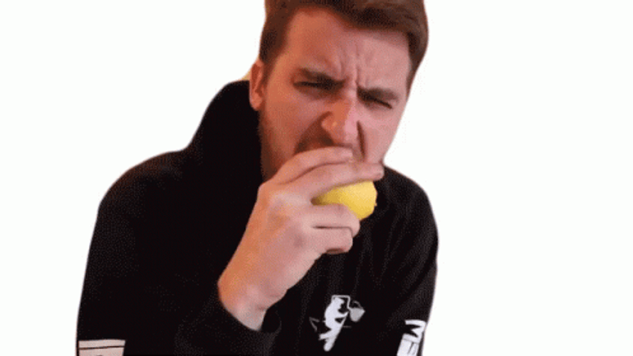 Man Eating Lemon With Sour Face GIF
