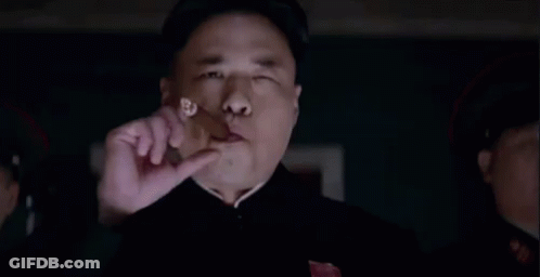 Man Eating Meat In Dark Room With Onlooker GIF