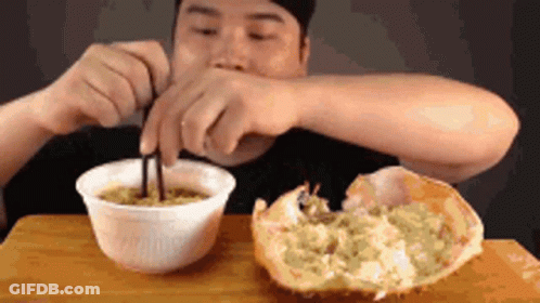 Man Eating Noodles With Crab GIF