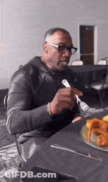 Man Eating Plate Of Food With Fork GIF