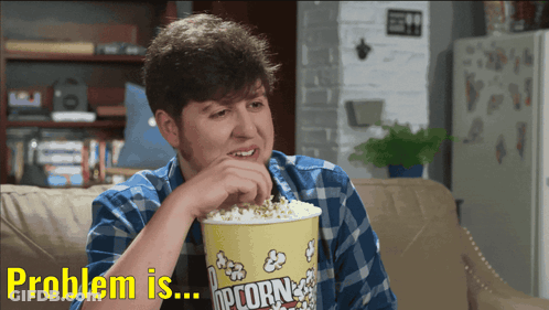 Man Eating Popcorn Saying Problem GIF