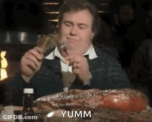 Man Eating Ribs With Fork And Knife GIF