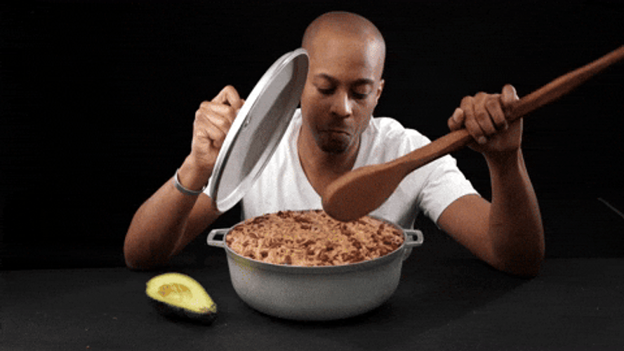 Man Eating Rice On Pan Using Big Spoon GIF
