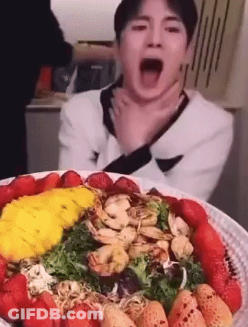 Man Eating Salad With Strawberries And Shrimp GIF