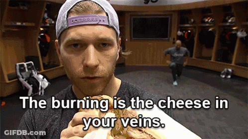 Man Eating Sandwich In Locker Room The Burning Is The Cheese In Your Veins GIF