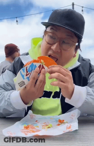 Man Eating Taco From Taco Bell Bag GIF