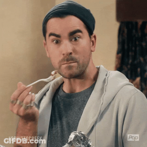 Man Eating With Spoon Wearing Schittscreek Shirt GIF