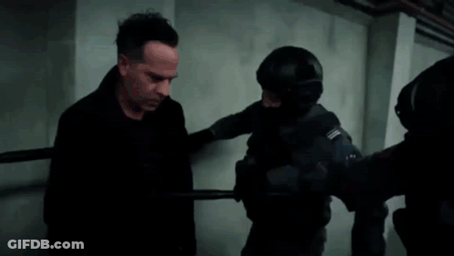 Man Escorted By Police Officer GIF