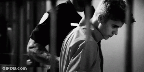 Man Escorted By Police Officer Black And White GIF