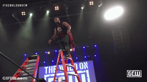 Man Falling Off Ladder In Wrestling Match GIF