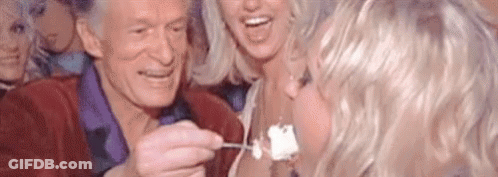 Man Feeding Woman Piece Of Cake GIF