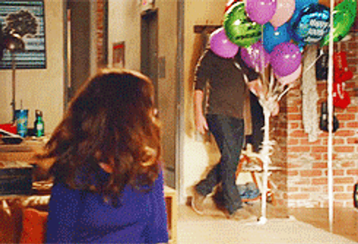 Man Fighting Balloons GIF