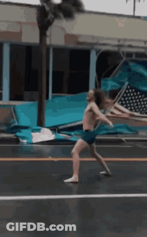 Man Fighting Windy Day GIF