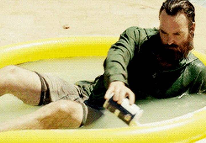 Man Filling Pool With Margarita GIF