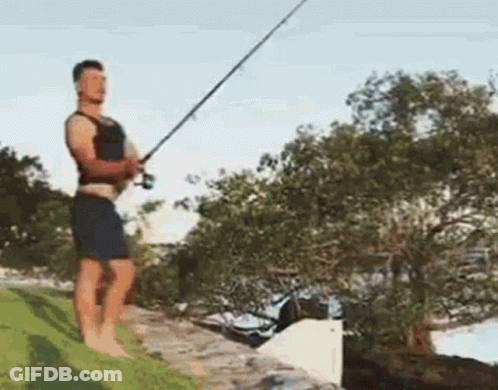 Man Fishing On Ledge GIF