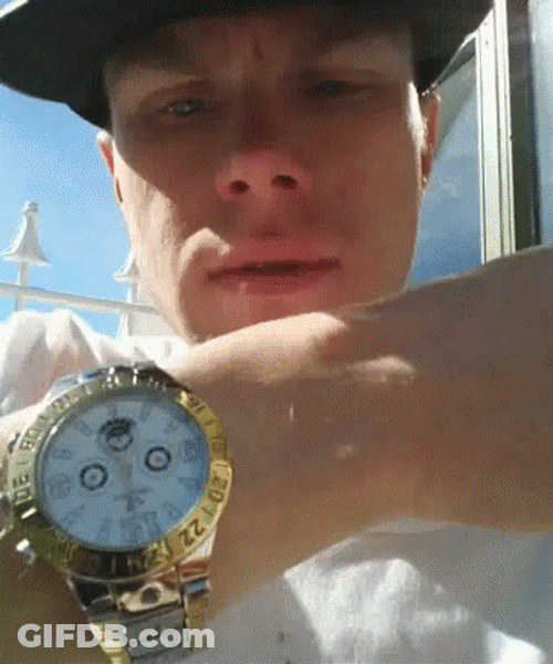 Man Flexing Gold Watch GIF