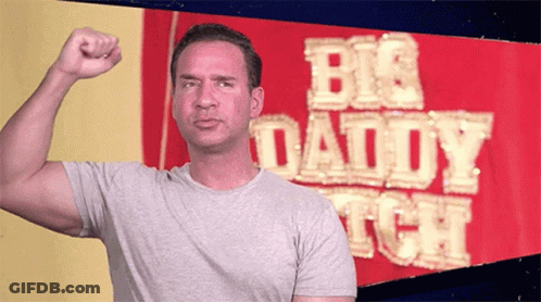 Man Flexing Muscles In Front Of Big Daddy Sign GIF