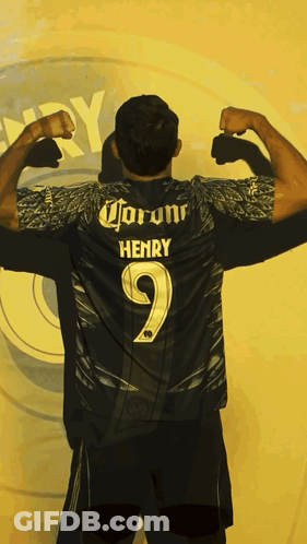 Man Flexing Muscles In Front Of Henry Sign GIF