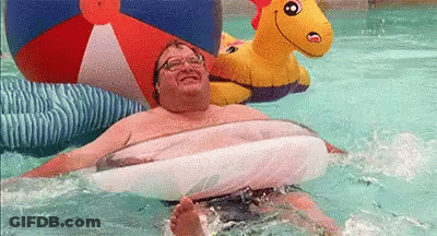 Man Floating In Pool On Raft GIF