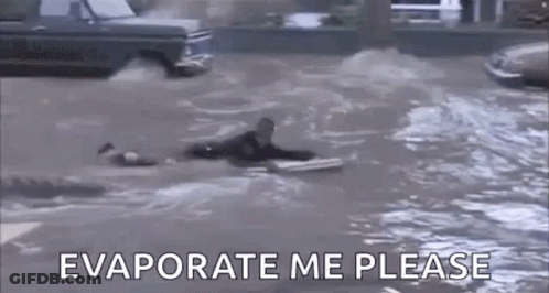 Man Floating On Surfboard In Flooded Street GIF