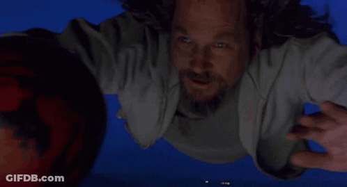 Man Flying Holding Bowling Ball GIF
