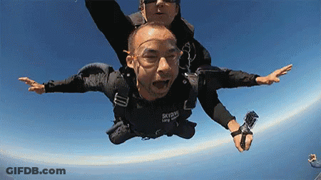 Man Flying In Black Skydive Shirt GIF