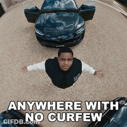 Man Flying Over Car Saying Anywhere With No Curfew GIF