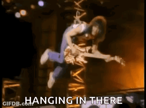 Man Flying With Guitar Hanging In There GIF