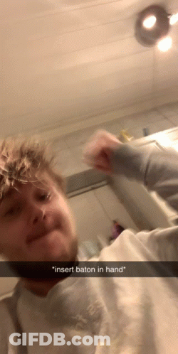 Man Funny Face Insert Baton In Hand GIF