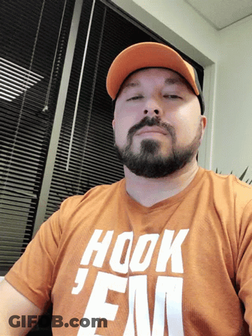 Man Gesturing Hook Em Sign GIF