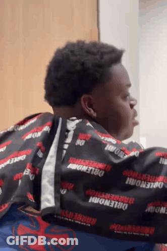 Man Getting Haircut By Barber In Barbershop Cape GIF