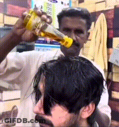 Man Getting Haircut From Bearded Man GIF