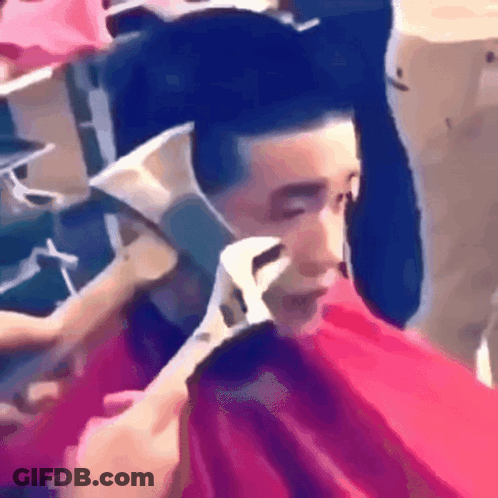 Man Getting Haircut While Wearing Mask GIF