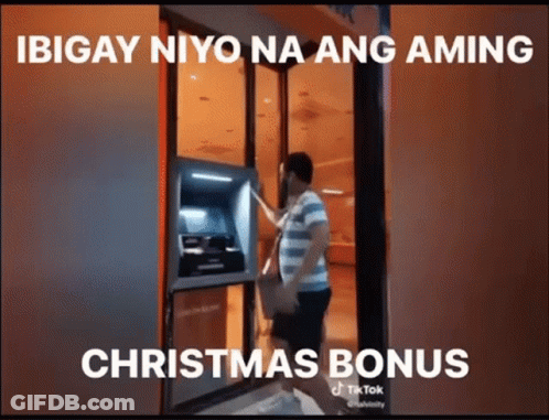 Man Getting Money From ATM With Christmas Bonus Caption GIF