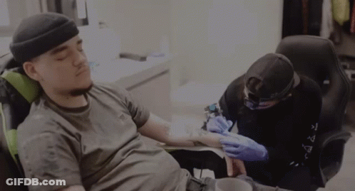 Man Getting Tattoo Wearing Black Hat GIF