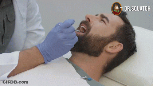 Man Getting Teeth Examined By Dentist With Dr. Squatch GIF