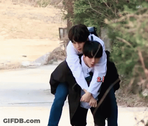 Man Giving Another Man A Piggyback Ride GIF