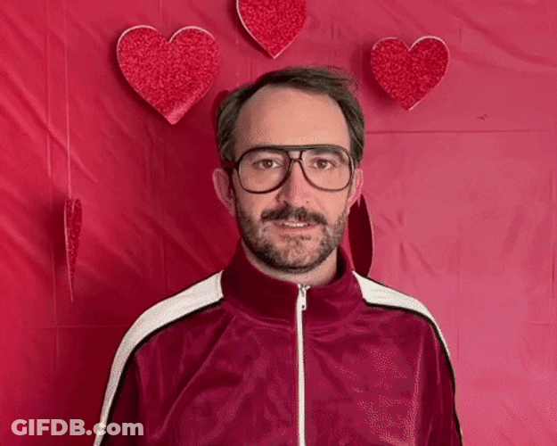 Man Giving Flowers And Hearts Happy Valentine's Day GIF