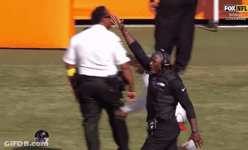 Man Giving High Five In Front Of Fox NFL Bonus Cover GIF