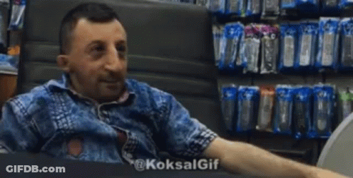 Man Giving High Five In Store Sitting In Chair GIF