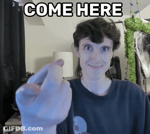 Man Giving Middle Finger In Front Of Come Here Sign GIF