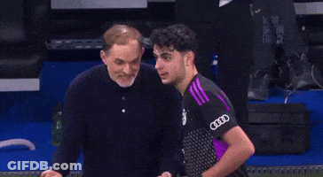 Man Giving Middle Finger To Man In Purple Audi Shirt GIF