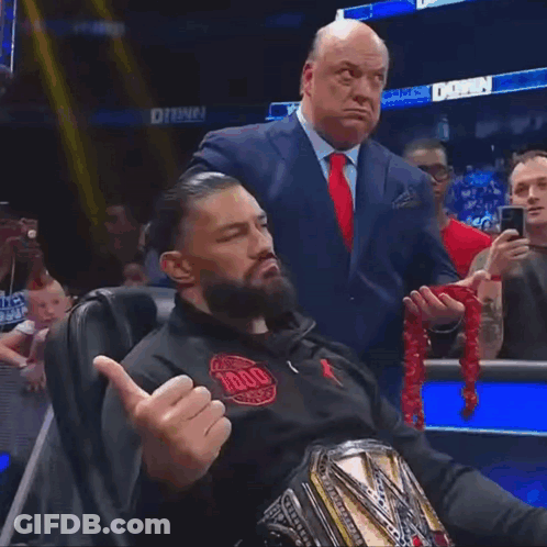 Man Giving Middle Finger With Suit Man Watching GIF