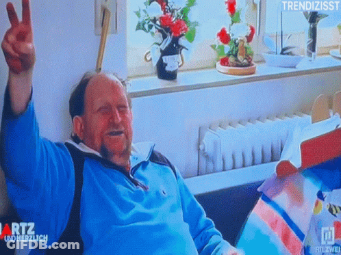Man Giving Peace Sign In Hospital Bed GIF