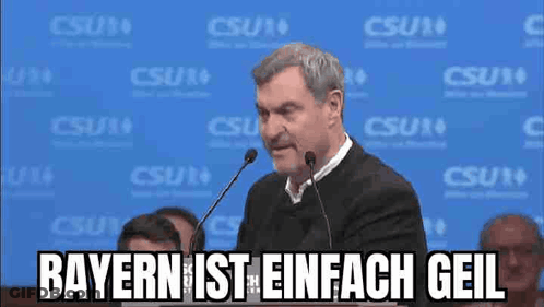 Man Giving Speech At Microphone Says Bayern Ist Einfach Geil GIF