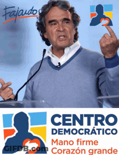 Man Giving Speech In Front Of Centro Democratico Sign GIF
